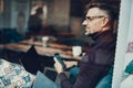 Man sitting in cafe with telephone in hand Royalty Free Stock Photo