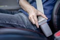 Man Sitting In Car Fastening Seat Belt, Safety belt safety first
