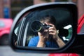 Man Sitting In Car Photographing