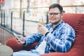 Man sitting in chair in caffe Royalty Free Stock Photo