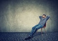 Man sitting on chair and daydreaming