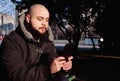 Man sitting in the city park, working with tablet Royalty Free Stock Photo