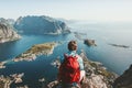 Man sitting on cliff edge alone enjoying aerial view Royalty Free Stock Photo