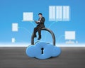 Man sitting on cloud shape lock with device Royalty Free Stock Photo