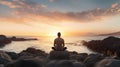 Man sitting in meditation position in front of the ocean