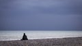 Man sitting in contemplation at beach Royalty Free Stock Photo