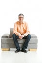 Man sitting on couch Royalty Free Stock Photo