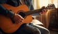 Man Sitting on Couch Playing Guitar Royalty Free Stock Photo