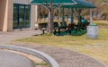 Man sitting on covered park bench Royalty Free Stock Photo