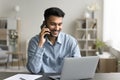 Man sitting at desk lead talk to client by phonecall