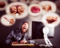 Man sitting at desk looking on computer screen