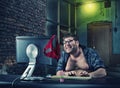 Man sitting at desk looking on computer screen