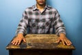 Man sitting at desk in a tense pose