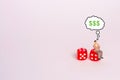 A man is sitting on dice and thinking about money on a white background. The concept of gambling. Probability theory. Lose in the Royalty Free Stock Photo