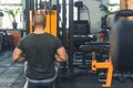 man sitting and doing exercises at the gym, back view healthy lifestyle bodybuilder Royalty Free Stock Photo