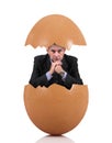 Man sitting into a egg Royalty Free Stock Photo