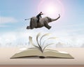 Man sitting on elephant running and jumping on flipping pages to