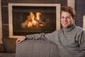 Man sitting by fireplace Royalty Free Stock Photo