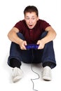 Man sitting on floor, holding joystick