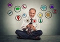 Man sitting on floor using texting on smartphone browsing web social media applications Royalty Free Stock Photo