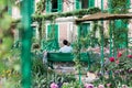 Man sitting in Giverny Garden, France Royalty Free Stock Photo
