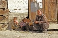 Man sitting with his kids and smiling in Swat district