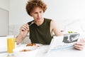 Man sitting at the kitchen eating pastries. Royalty Free Stock Photo