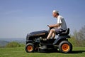 Man sitting on a lawnmower Royalty Free Stock Photo