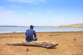 A man sitting lonely on beach. Royalty Free Stock Photo