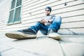 Man sitting, looking at his notebook and writing something - low angle shot Royalty Free Stock Photo