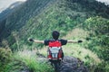 Man sitting on mountain adventure travel concept Royalty Free Stock Photo