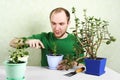 Man sitting near table with gardening equipment Royalty Free Stock Photo