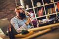 Man sitting in office with a cup of coffee,smoking cigarrette Royalty Free Stock Photo