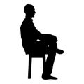 Man sitting pose Young man sits on a chair with his leg thrown silhouette icon black color illustration Royalty Free Stock Photo