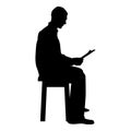 Man sitting reading Silhouette concept learing document icon black color illustration