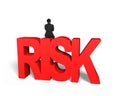 Man sitting on red 3D risk word