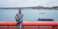 Man sitting on a red railing