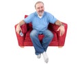 Man sitting with a remote and al bored look Royalty Free Stock Photo