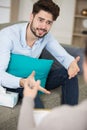 man sitting on sofa feeling hopeless Royalty Free Stock Photo