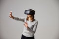 Man Sitting On Sofa At Home Wearing Virtual Reality Headset Royalty Free Stock Photo