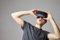 Man Sitting On Sofa At Home Wearing Virtual Reality Headset Royalty Free Stock Photo