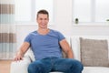 Man Sitting On Sofa In Living Room Royalty Free Stock Photo