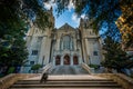 Man sitting on the steps of First United Methodist Church, in Up