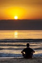 Man Sitting Sunrise Sunset Beach Contemplation Royalty Free Stock Photo