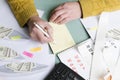 Man sitting at the table and counting his money, making some savings Royalty Free Stock Photo