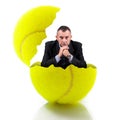 Man sitting in a tennis ball