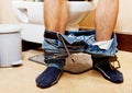 Man sitting on a toilet seat