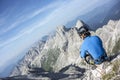 Man sitting on top of the mountain Royalty Free Stock Photo