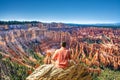 Man sitting on top of the mountain looking at beautiful view Royalty Free Stock Photo