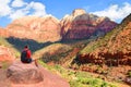 Man sitting on top of the mountain and resting. Royalty Free Stock Photo